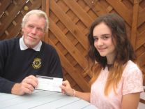 Girl Guide Phoebe Roberts receives £100 from Honiton Lions 